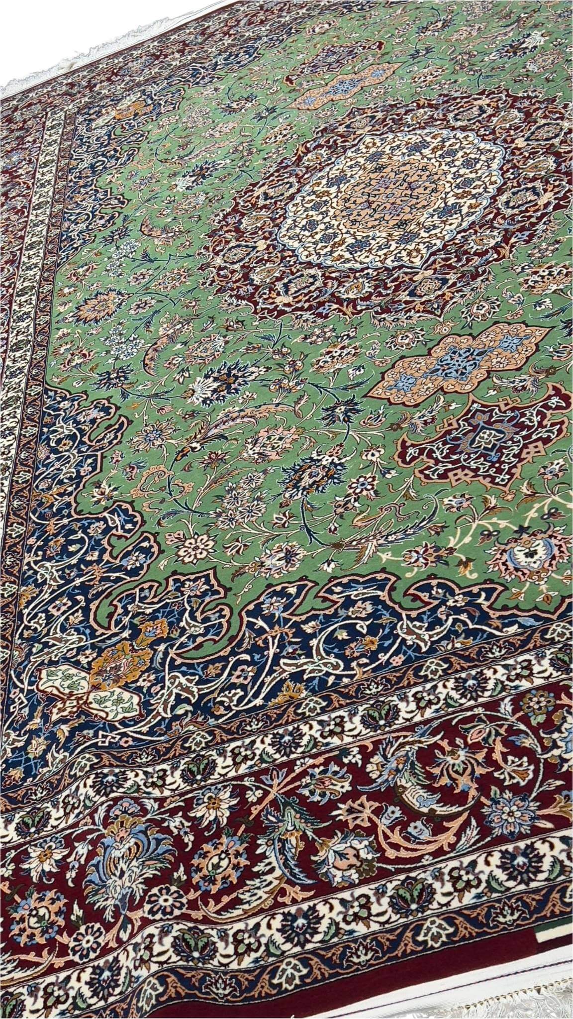 "Hand-knotted Isfahan rug with traditional colors and luxurious pile"